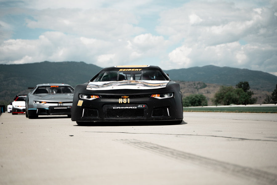 RS1 Camaro race cars lined up on the Area 27 circuit
