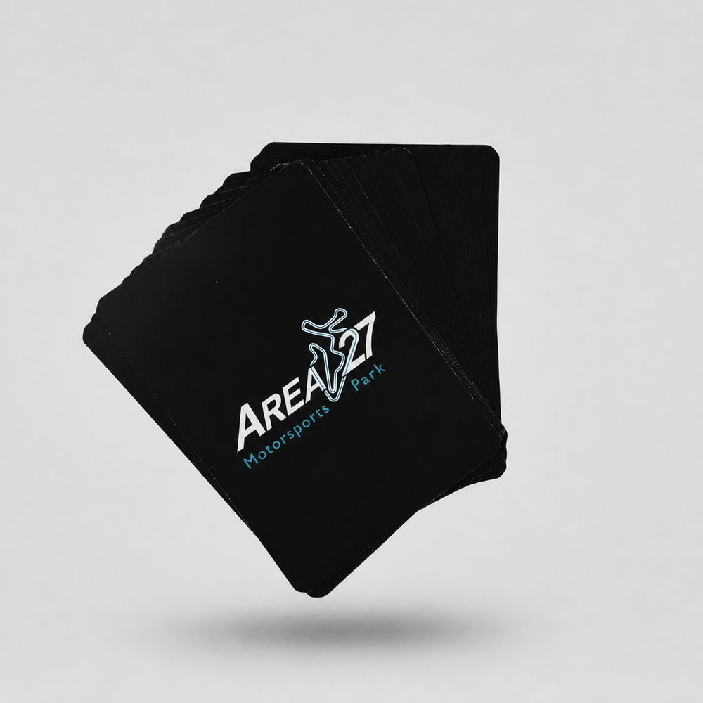 Area 27 playing cards on a light grey studio background